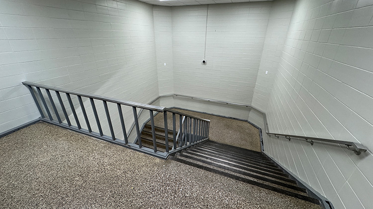 The stairwells have been brightened with replacement of darker tile.